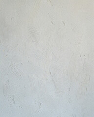 Textured plaster wall backdrop in off white tones with subtle imperfections, ideal for portraits, product shoots, or artisanal wallpaper backgrounds.

