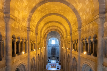 The grand medieval gothic interior of St Paul's Cathedral with vaulted ceiling, arched stone...