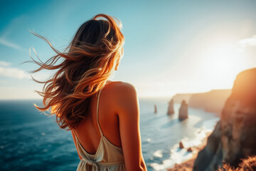 Naklejka premium Woman Contemplating Ocean View at Sunset