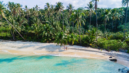 Explore Koh Kood Islands Thailand stunning pink beaches and lush palm trees, an ultimate...