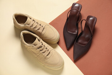 Different stylish shoes on color background, flat lay