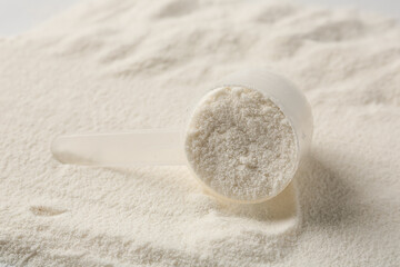 Collagen powder and scoop as background, closeup
