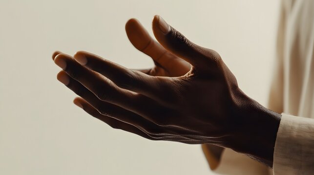 Close-up of dark-skinned hands cupped gently, conveying prayer, offering, or reception. - Powered by Adobe