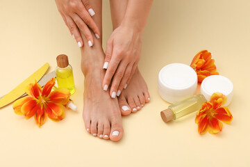 Woman showing neat toenails and fingernails after pedicure and manicure procedures, tools, cosmetic...