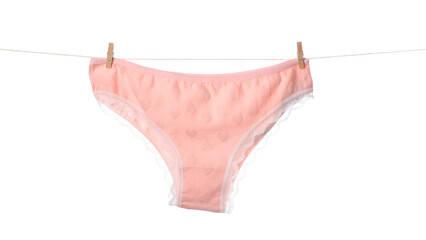 Beautiful panties on clothes line against white background