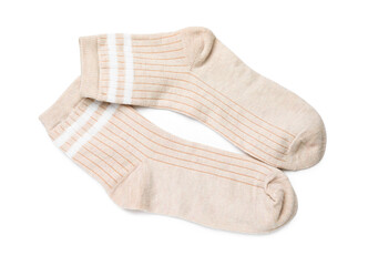 Pair of beige socks isolated on white, top view