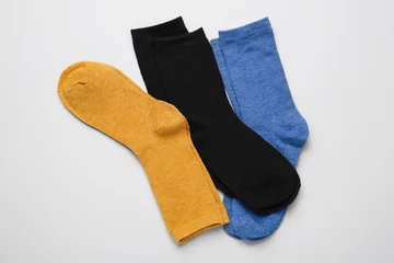  Many different pairs of socks on light background, top view © New Africa