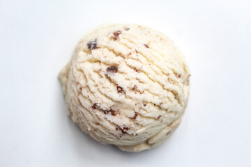 Fototapeta premium a scoop of vanilla ice cream with cookie sprinkles, isolated on a white background