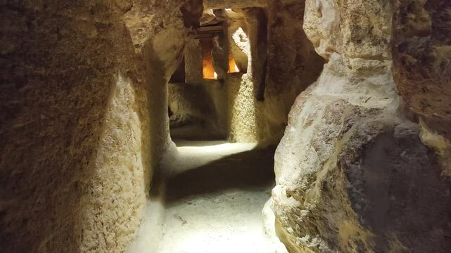 The Grand Gallery and the Ascending Passage towards the King's Chamber inside of the Great Pyramid of Giza, Egypt. View of the dark tunnel inside the pyramid with steps.