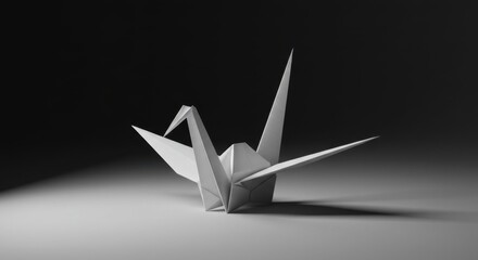 A single origami crane stands on a surface against a dark background