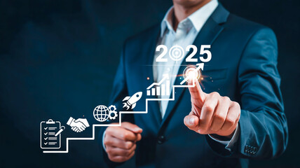 A digital business concept image showing a person in a blue business suit reaching up to touch a holographic staircase interface against a dark background