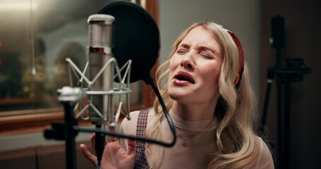 Music, microphone and woman with singing in studio for entertainment, production and broadcast. Artist, headphones and musician with song for audio media, sound and recording of album at record label