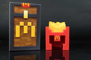Fototapeta premium Bangkok, Thailand - April 6, 2025 : Fry Helmet Minecraft from McDonald, Toy form Minecraft blind box from McDonald's collaborates Minecraft the movice