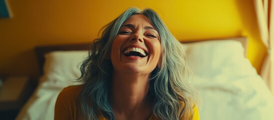 Fototapeta premium Joyful exuberance, silver haired woman enjoying a moment of carefree laughter