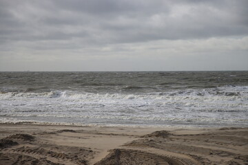 Waves on the shore and beach at Noordwijk beach