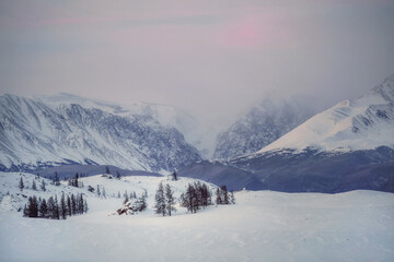 Twilight mountains covered with snow.