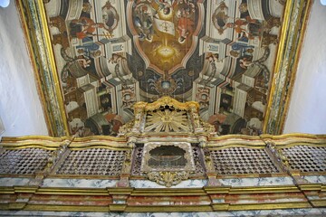 Catholic religious art in 18th century Baroque style church. Ceiling painting and gilded metal art in the Church of Sao Francisco in Joao Pessoa, northeastern Brazil