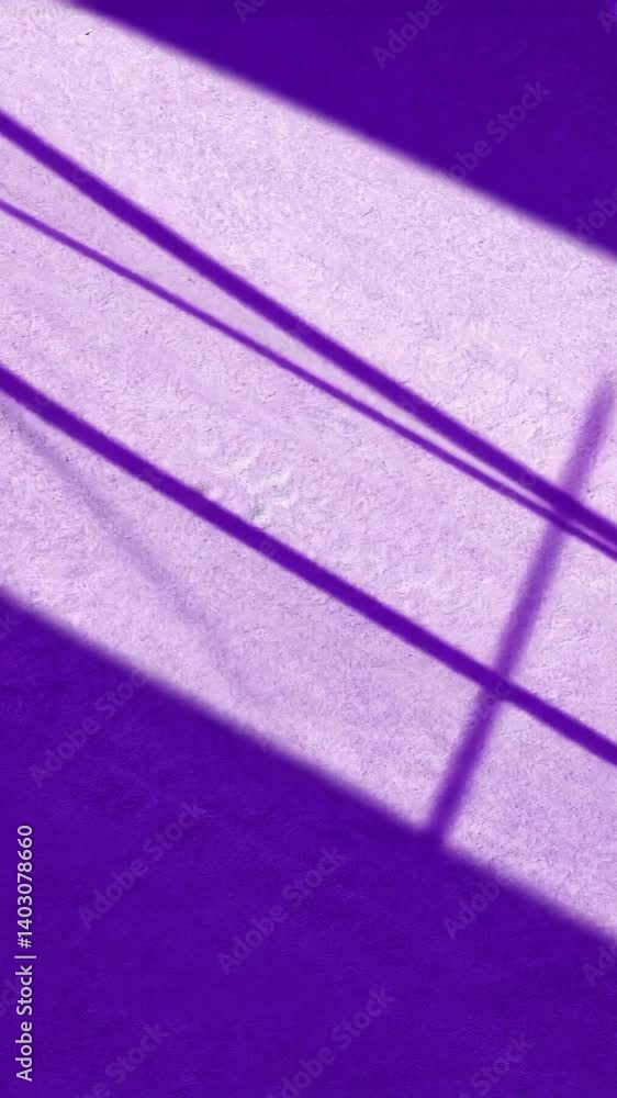 Poster abstract purple wall with light and shadow patterns. lines of light and darkness cross the textured 
