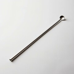Stainless steel cocktail stirrer with round paddle end on white background