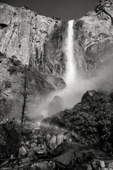 Black and white photo of Bridalveil Falls and the rainbow. Those falls are located in Yosemetie National Park in California