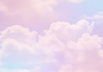 Fototapeta premium Soft pastel clouds float gently in a dreamy sky with hues of pink, purple and light blue gradient color