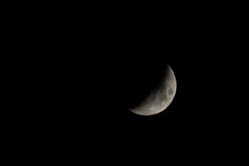 Detailed Crescent Moon in the night sky. Crescent Moon on black background with space for Ramadan...
