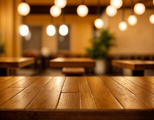 Empty wood table top on blur light gold bokeh of cafe restaurant