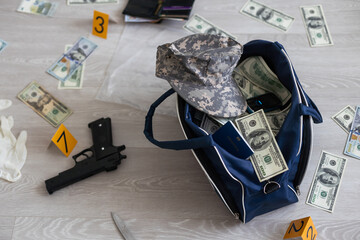  collecting evidence standing behhind yellow crime scene tape