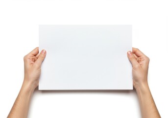 Hands holding a blank white rectangular piece of paper against a plain white background image view
