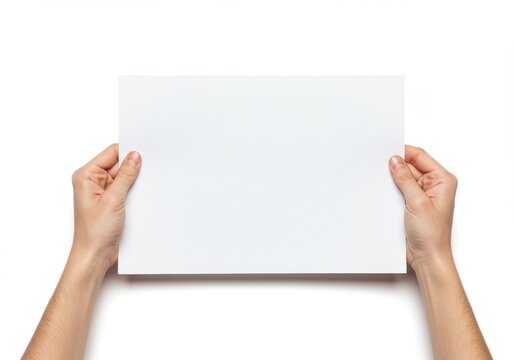 Hands holding a blank white rectangular piece of paper against a plain white background image view