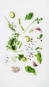 Fresh Green Herbs and Vegetables Flat Lay on White Background