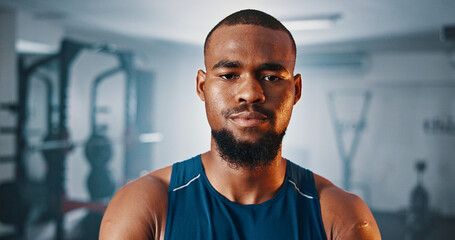 Portrait, fitness and serious black man in gym for exercise, muscle and strength training for...