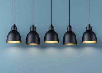 Elegant Black Pendant Lamps Hanging Against Light Blue Wall