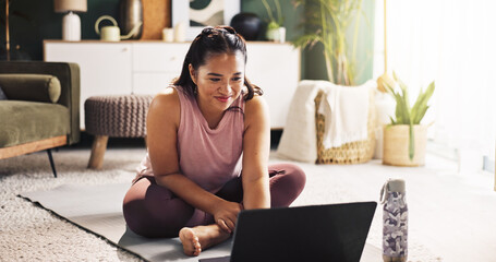 Happy, asian woman and yoga with laptop for online class, tutorial or zen workout on floor at home....