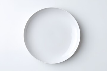 Clean white plate isolated on white background