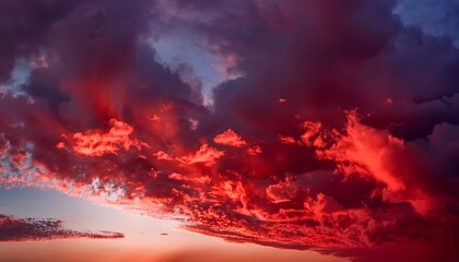 Naklejka premium Red cloud texture background. Blurred photo of red sky with clouds. Generated image