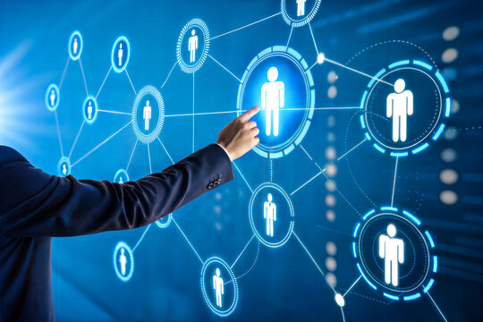 A businessman's hand points to a highlighted person icon within a network of connected digital person icons, suggesting a concept of human resources, talent acquisition, or networking.