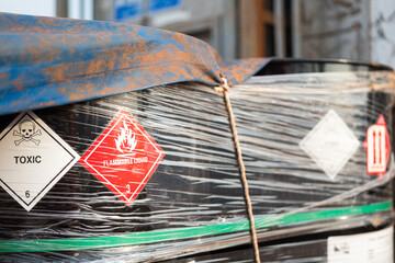 Flammable placard symbol on the fuel oil or chemical containment drum. Safety sign for industrial...