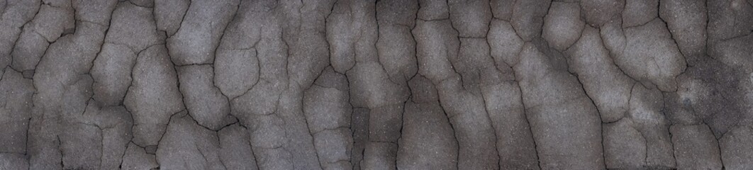 Rissige Betonstruktur (Concretum fractum) in dramatischem Breitbildpanorama. Perfekt als Textur...