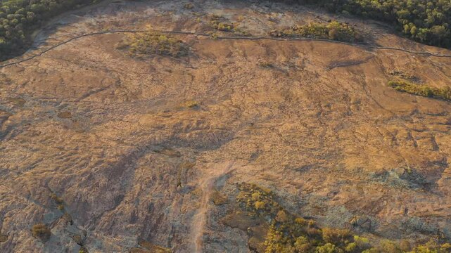 View of the surface of a monolithic rock in the outback Western Australia, Aerial View from the top, Wheatbelt, Hyden, Wheatbelt, Goldfields, Australia