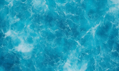 Obraz premium Aerial view of vibrant blue ocean waves crashing gently, showcasing the beauty of nature