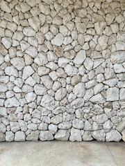 Rough gray broken stone wall background