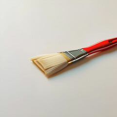 painting brush for a paint with the red handle and a natural bristle white background