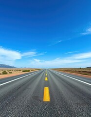 Naklejka premium Endless asphalt ribbon stretches towards a vibrant blue sky, peaceful, highway