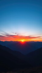 Fototapeta premium Sunrise paints vibrant blue and orange hues across a majestic mountain range at the horizon, geology, range, scenery