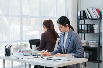 Two Businesswomen Working in Bright Office