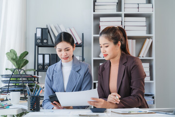 Two Businesswomen Collaborating in Office