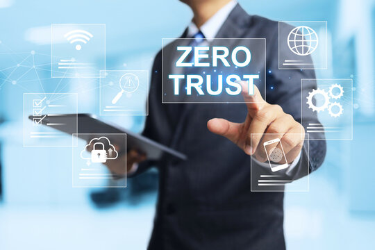 Zero Trust concept with businessman pointing to security system where every user and every device must be authenticated before being granted access to organization’s systems, applications, or assets.
