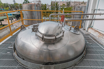 Stainless vertical steel tanks with equipment tank chemical cellar at the with stainless steel tanks cleaning and mixing