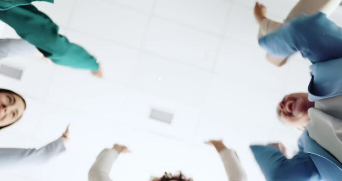 Office, business people and huddle with hands for celebration, investment success or applause by confetti. Below, employees or finance team with stack for motivation, glitter or financial achievement